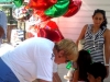 bev-macnellis-treasurer-gives-balloons-to-the-kids