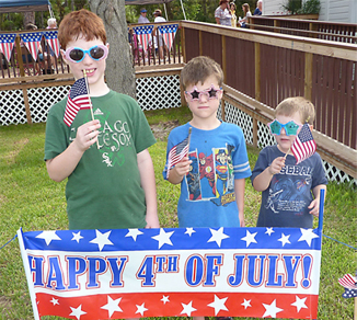 19-three-boys-with-glasses-and-flages